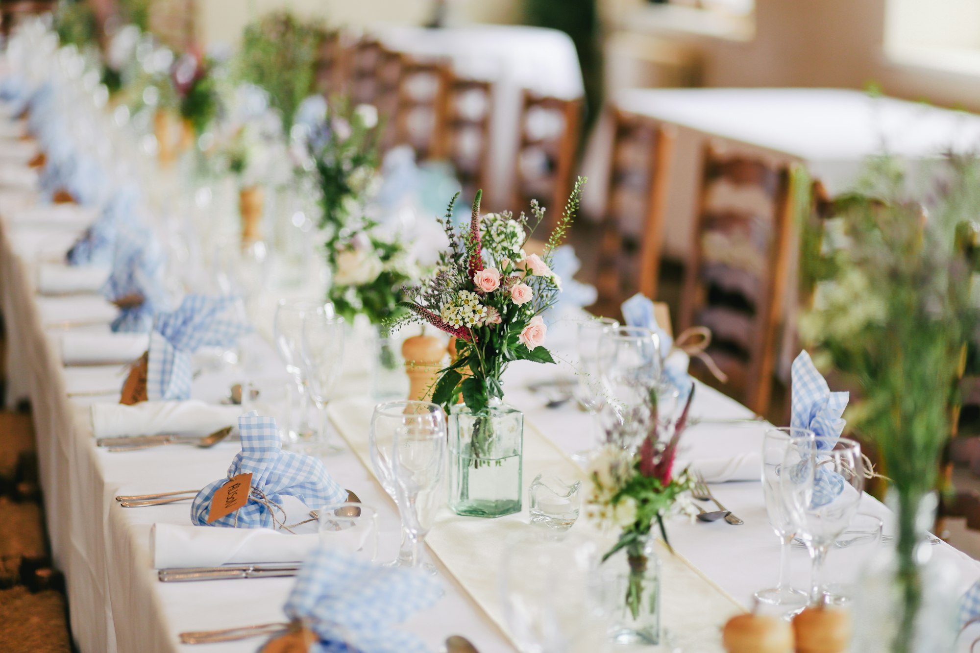 Luxurious Indian wedding banquet with warm florals and elegant table settings